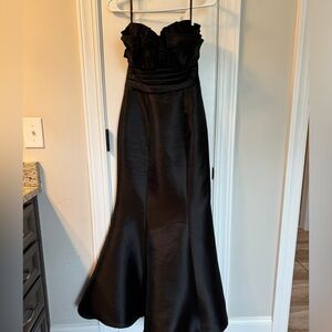 Black formal strapless; mermaid profile.